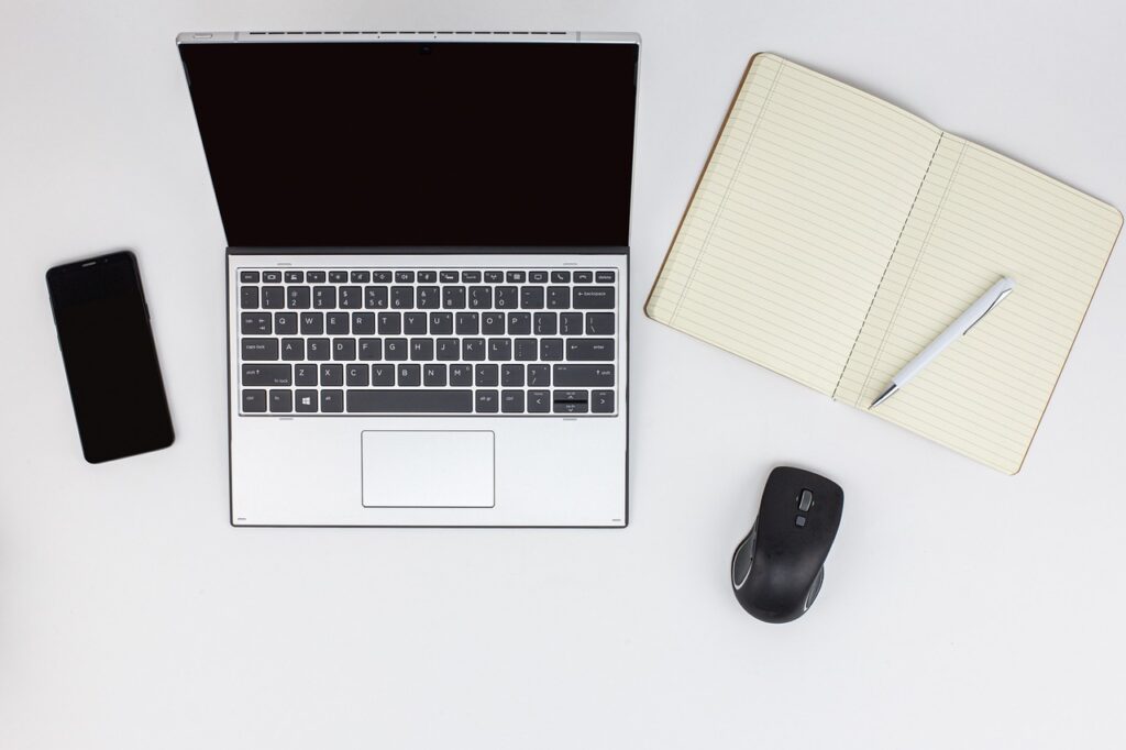 laptop, mobile phone, notepad